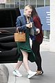 dakota fanning keeps it casual and trendy for la business meeting 07