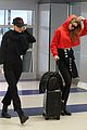 gigi and bella hadid coordinate their looks while arriving back in nyc 09