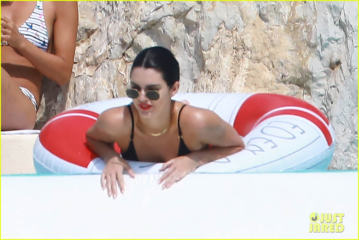kendall jenner rocks black thong swimsuit while poolside in cannes 14