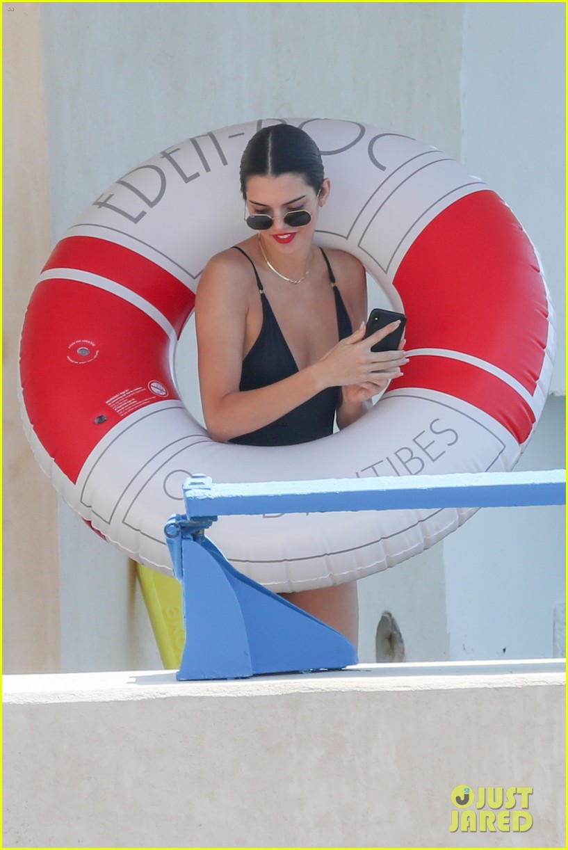 kendall jenner rocks black thong swimsuit while poolside in cannes 16