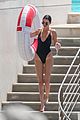 kendall jenner rocks black thong swimsuit while poolside in cannes 11