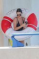 kendall jenner rocks black thong swimsuit while poolside in cannes 16