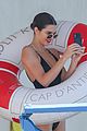 kendall jenner rocks black thong swimsuit while poolside in cannes 17