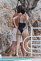 kendall jenner rocks black thong swimsuit while poolside in cannes 25