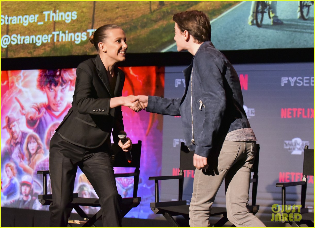 millie bobby brown naoh schnapp hold hands at stranger things panel 12