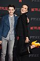 millie bobby brown naoh schnapp hold hands at stranger things panel 03