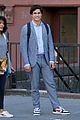 charles melton wears suit sneakers for filming 01