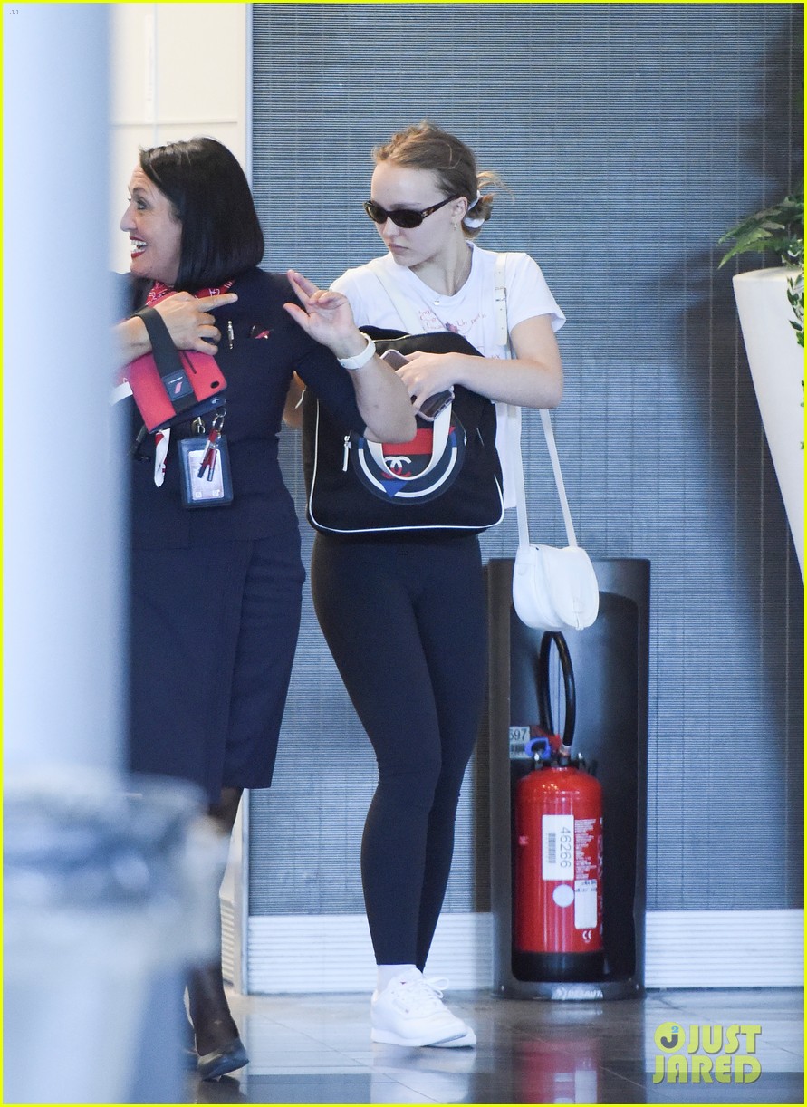 lily rose depp sports french cartoon t shirt while heading to paris 05