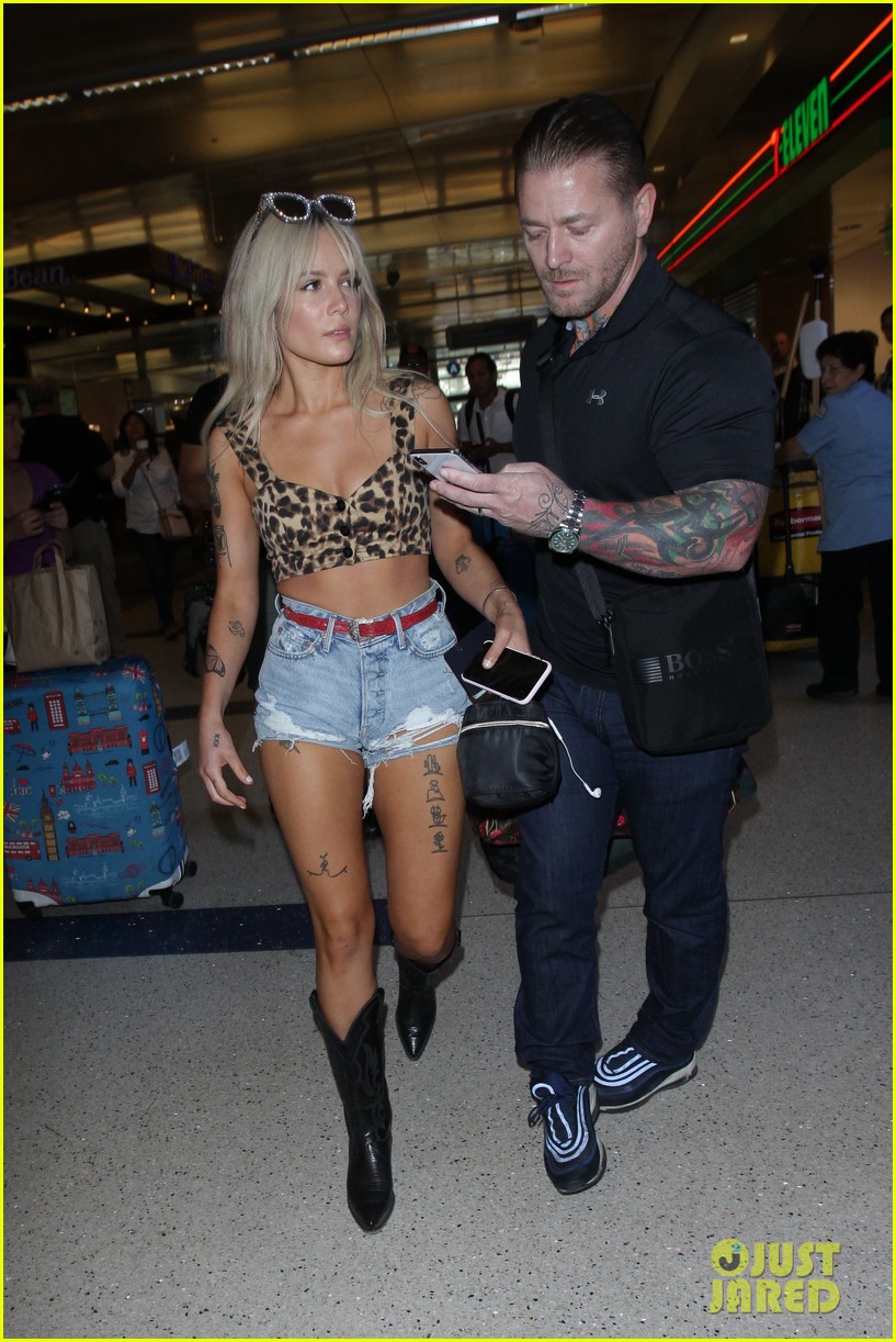 halsey looks fierce in leopard print crop top and cowboy boots at lax airport 06