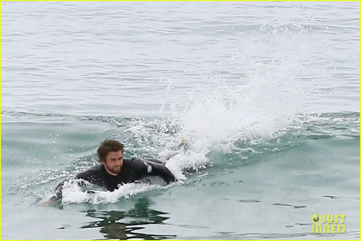 liam hemsworth bares hot bod while stripping out of wetsuit 20