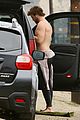 liam hemsworth bares hot bod while stripping out of wetsuit 01