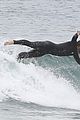 liam hemsworth bares hot bod while stripping out of wetsuit 11