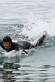 liam hemsworth bares hot bod while stripping out of wetsuit 19