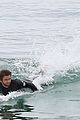 liam hemsworth bares hot bod while stripping out of wetsuit 20