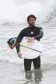 liam hemsworth bares hot bod while stripping out of wetsuit 30