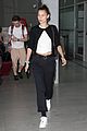 bella hadid dons black and white ensemble while touching down in paris 01