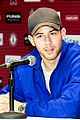nick jonas helps strike out slavery at press conference ahead of concert 03