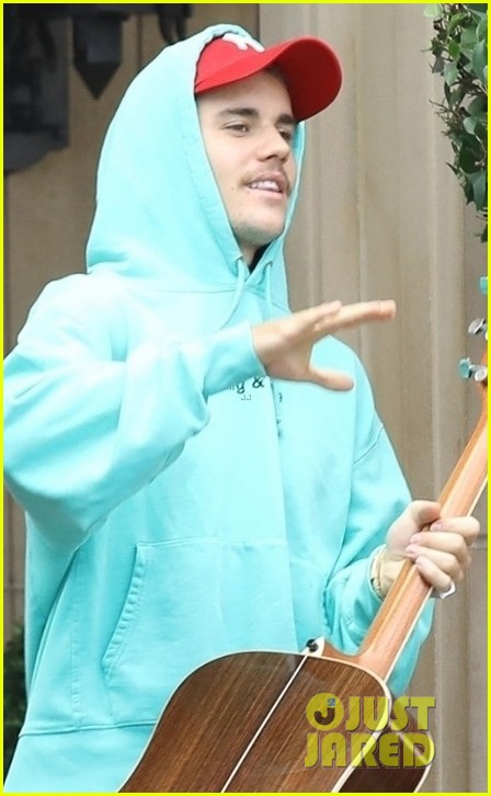 justin bieber steps out with his guitar in beverly hills 02