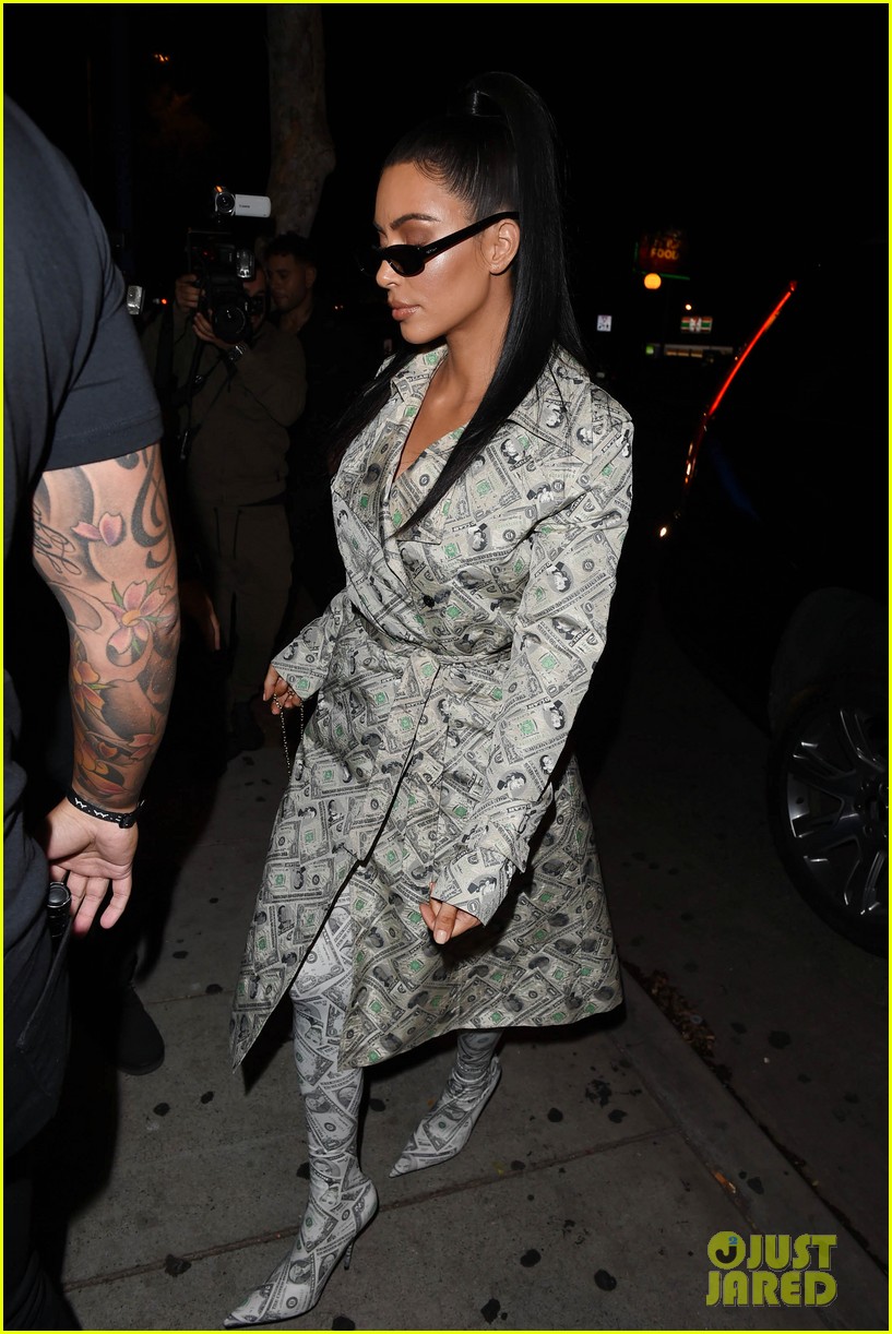 kim kardashian wears dollar bill covered coat and boots while out with kylie jenner09