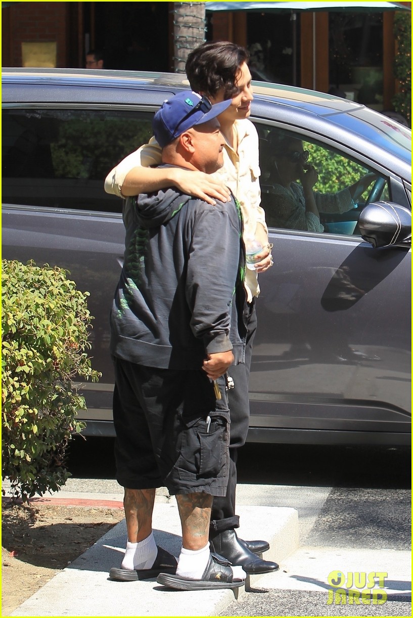 cole sprouse snaps a pic with a fan while running errands in la 02