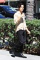 cole sprouse snaps a pic with a fan while running errands in la 01