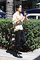 cole sprouse snaps a pic with a fan while running errands in la 04