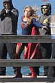 melissa benoist films intense supergirl scene with masked men 03
