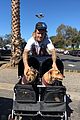 justin bieber poses with two dogs in a stroller before soccer game04.