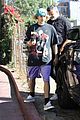 justin bieber poses with two dogs in a stroller before soccer game07
