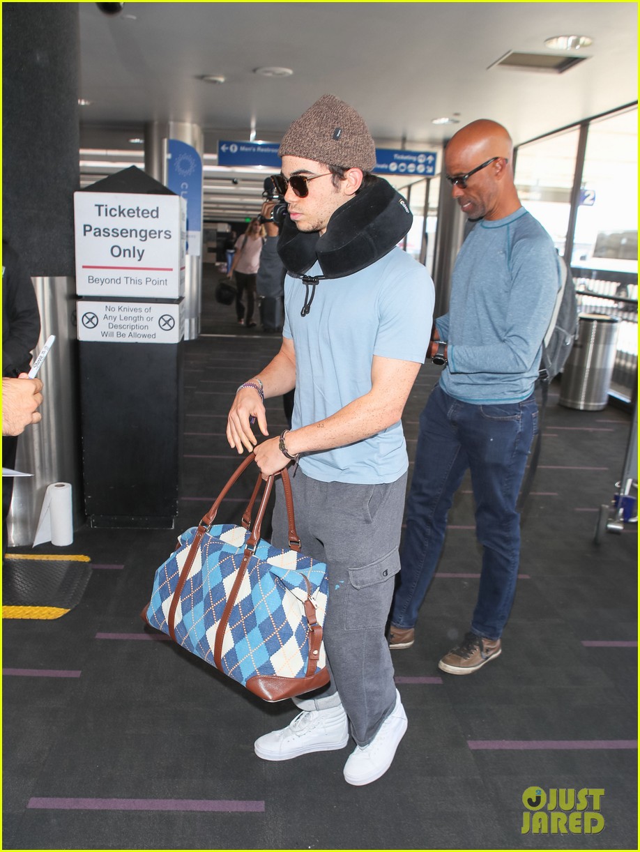 cameron boyce is all smiles while catching his flight out of lax03