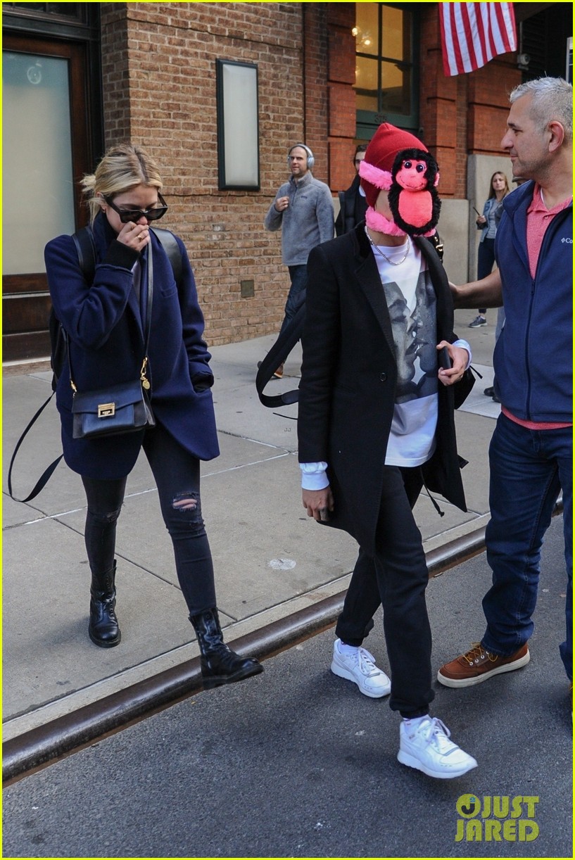 cara delevingne makes ashley benson laugh while stepping out with stuffed monkey on her face02