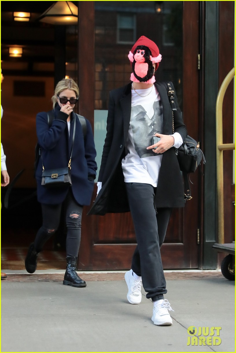 cara delevingne makes ashley benson laugh while stepping out with stuffed monkey on her face03