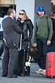 elle fanning and olivia wilde share a laugh at jfk airport with jason sudeikis04