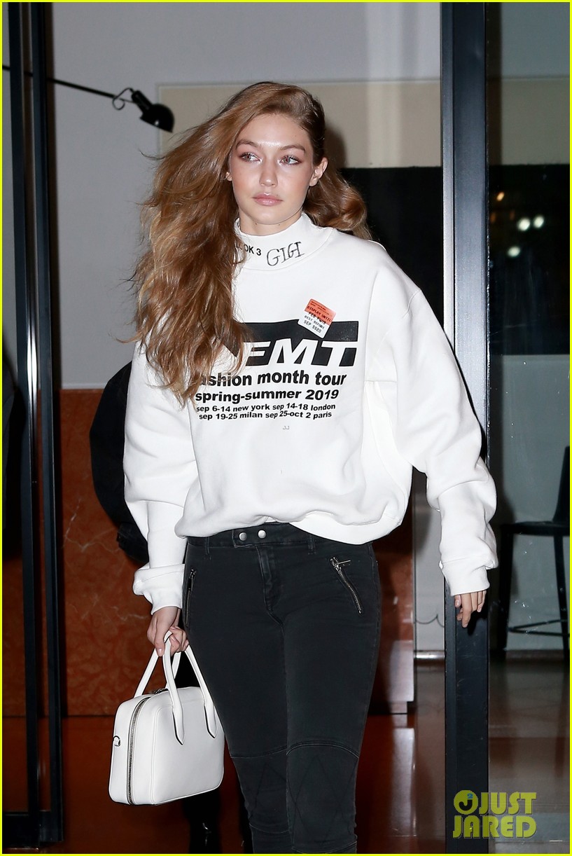 gigi hadid wears hair to one side shows name on sweater 01
