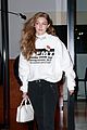 gigi hadid wears hair to one side shows name on sweater 01