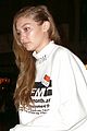 gigi hadid wears hair to one side shows name on sweater 02
