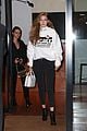 gigi hadid wears hair to one side shows name on sweater 03