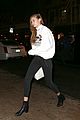 gigi hadid wears hair to one side shows name on sweater 04