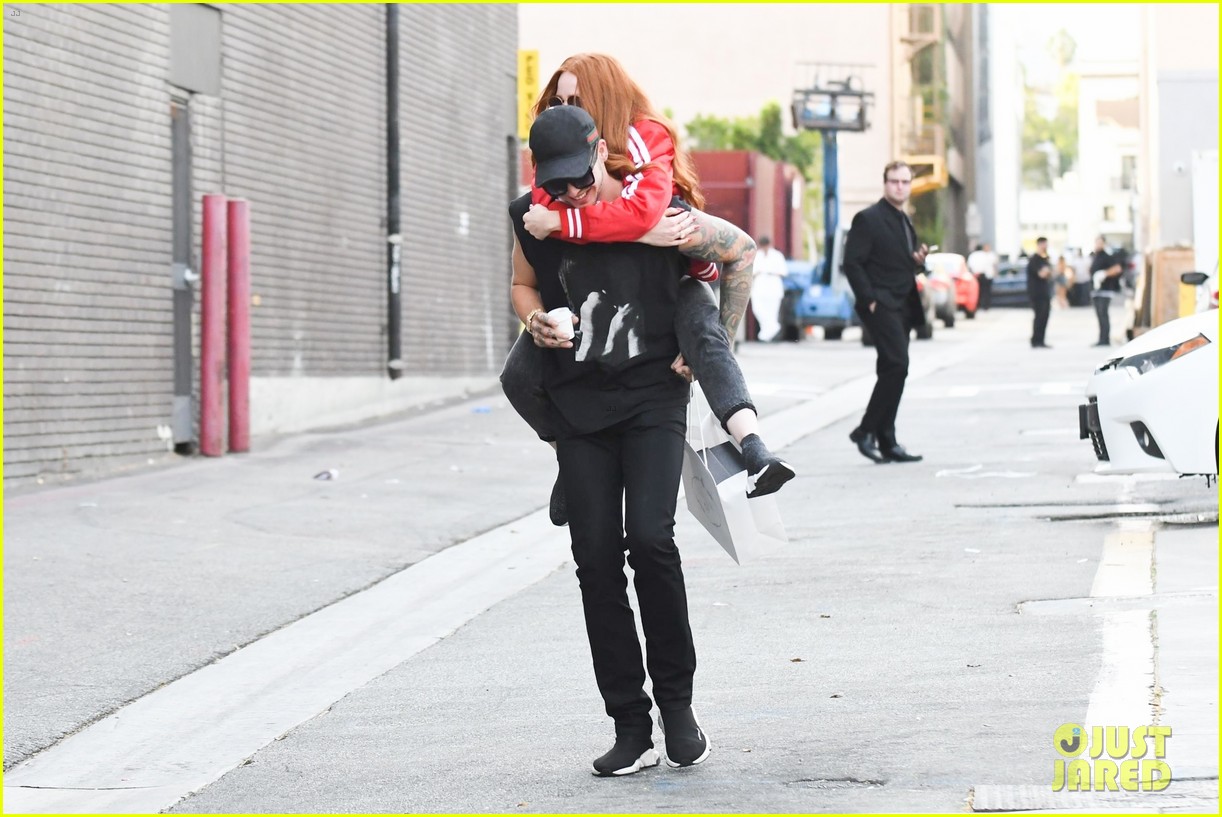 madelaine petsch gets piggyback ride from boyfriend travis mills while out shopping06