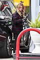 ashley benson makes pit stop to fuel her suv 01