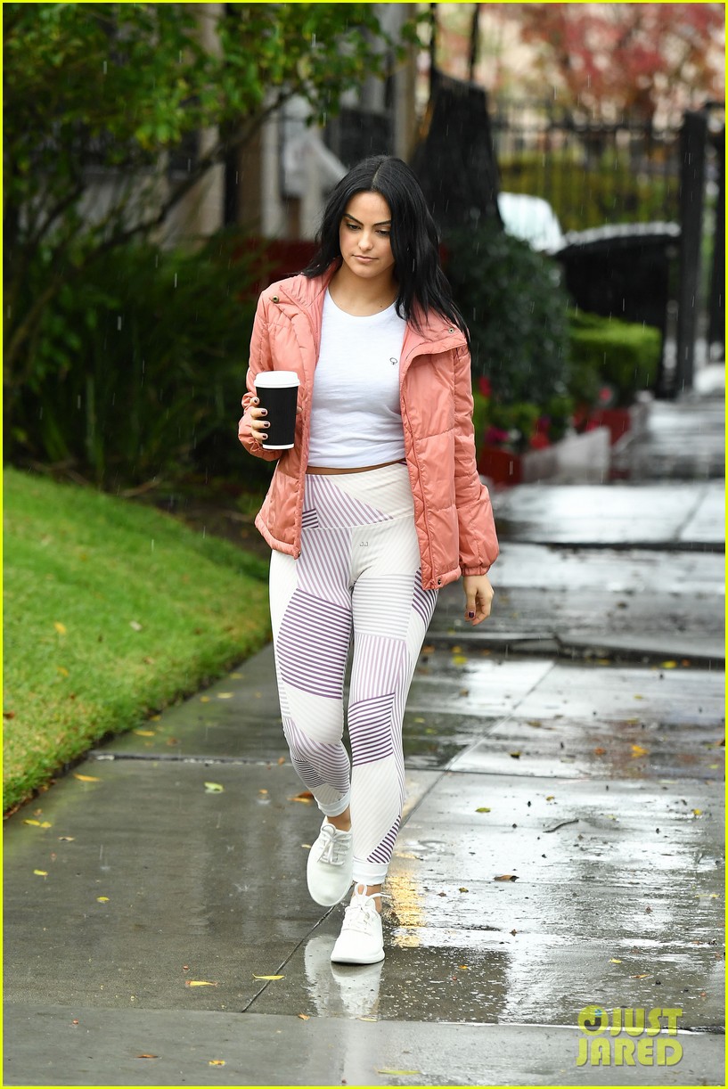 camila mendes braves the rain for coffee run 04