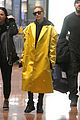 hailey bieber sports bright yellow coat for flight to paris 05