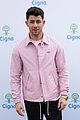 nick jonas cozies up to a puppy at cigna event 04