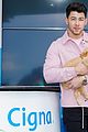 nick jonas cozies up to a puppy at cigna event 05