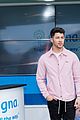 nick jonas cozies up to a puppy at cigna event 09