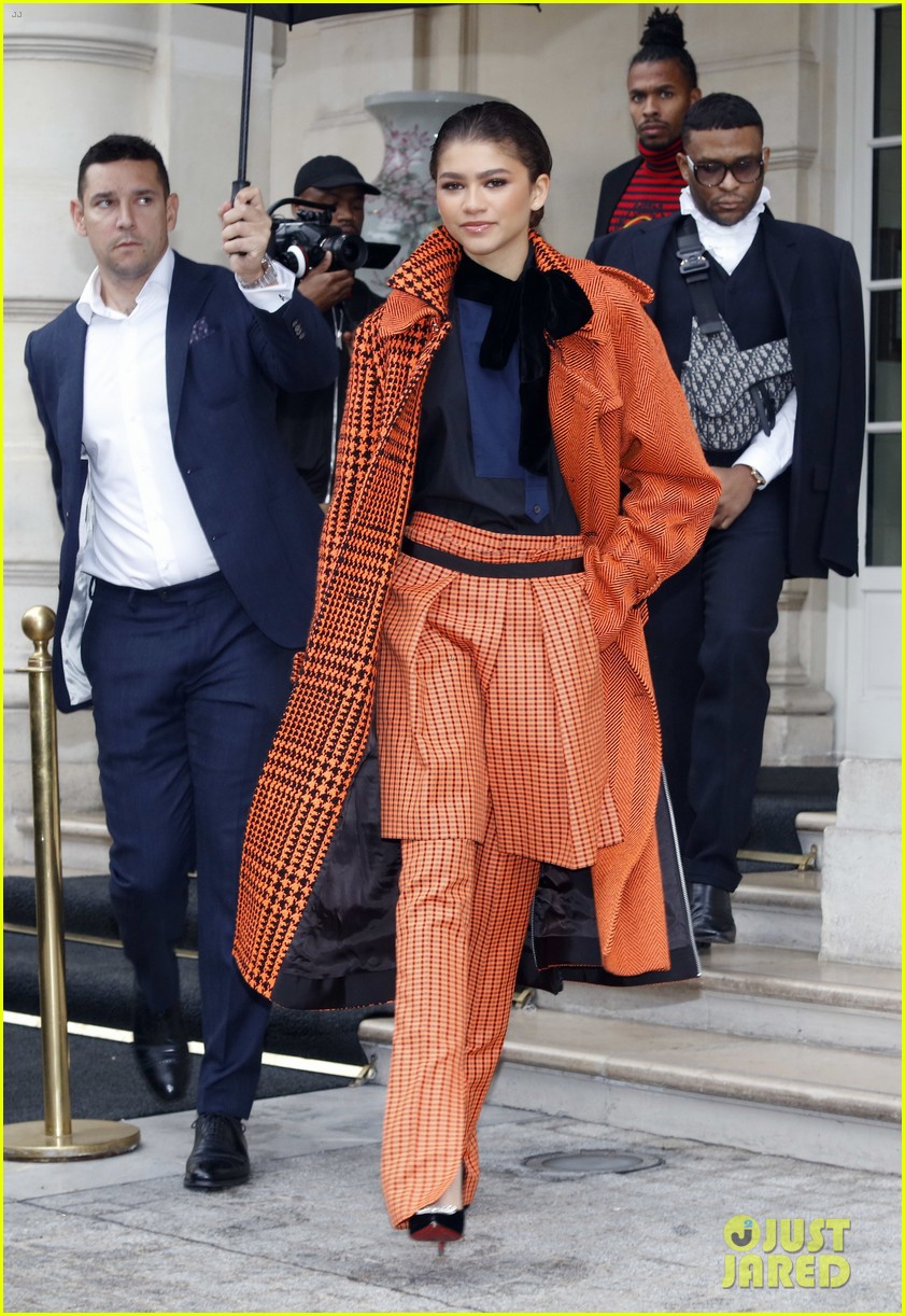 zendaya pops in orange while out during paris fashion week 05