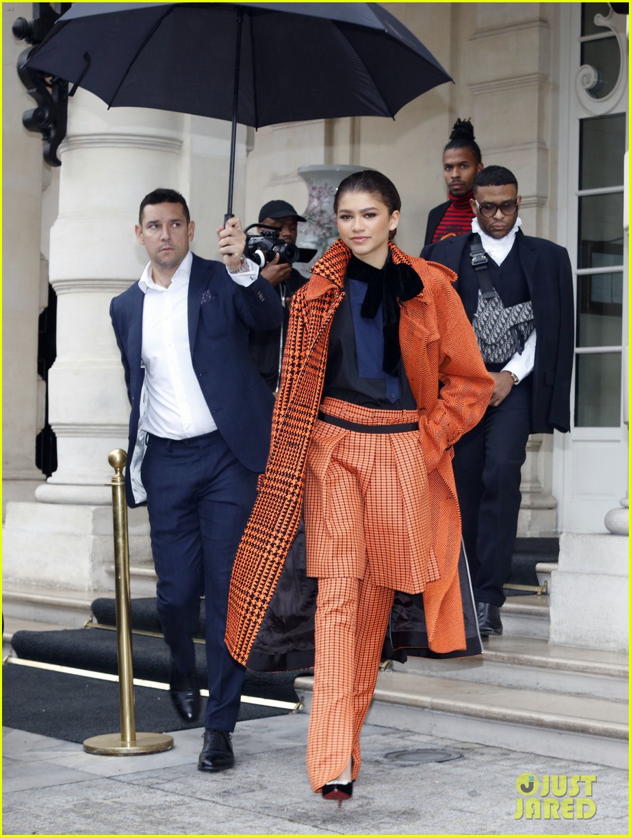 zendaya pops in orange while out during paris fashion week 06