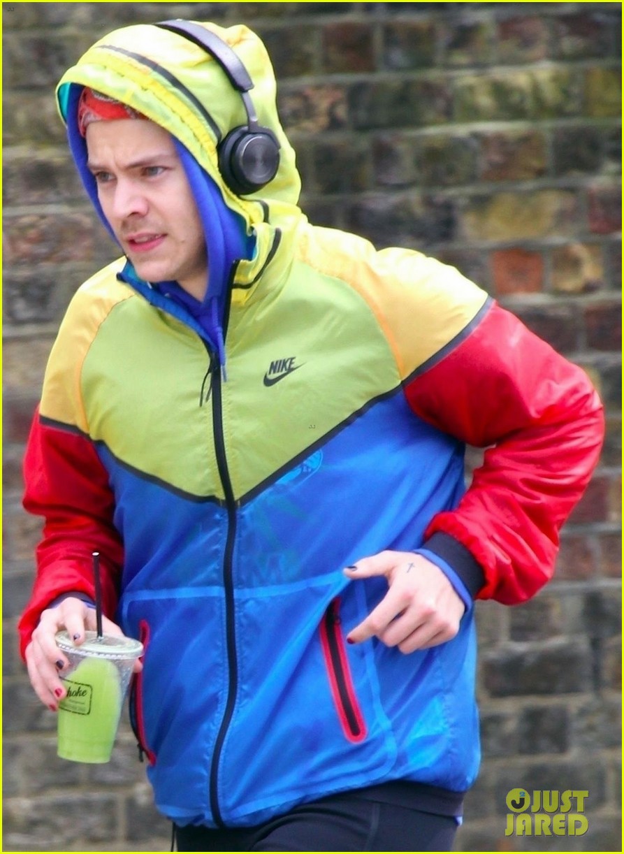 harry styles sports colorful jacket while jogging in london 02