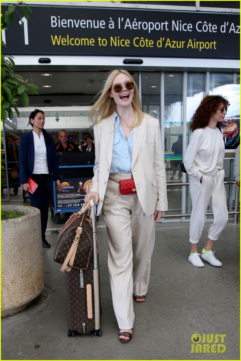 elle fanning makes chic arrival ahead of cannes film festival 01