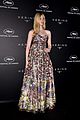 elle fanning wears a painting on her dress at kering women in motion awards 08